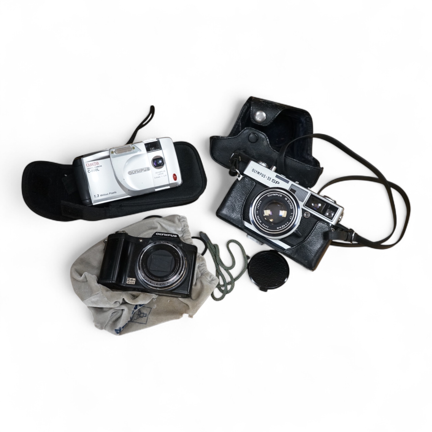 A cased Olympus 35SP camera, together with two more recent digital cameras
